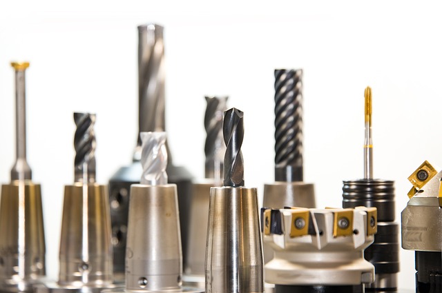 CNC router software comparison 2026 - Carbide drill bit on blue background representing CNC tooling and software tools - CNC Dance review