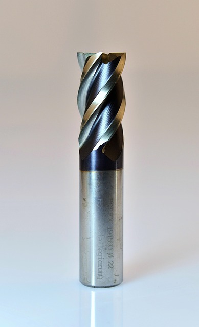 CNC toolpath troubleshooting guide - Milling cutter cutting metal with chips and coolant showing surface finish quality - CNC Dance guide